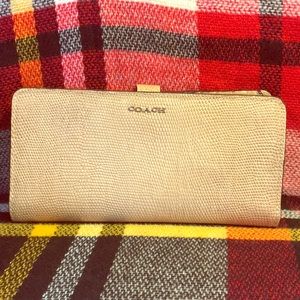 Coach snake skin beige with gold hardware.